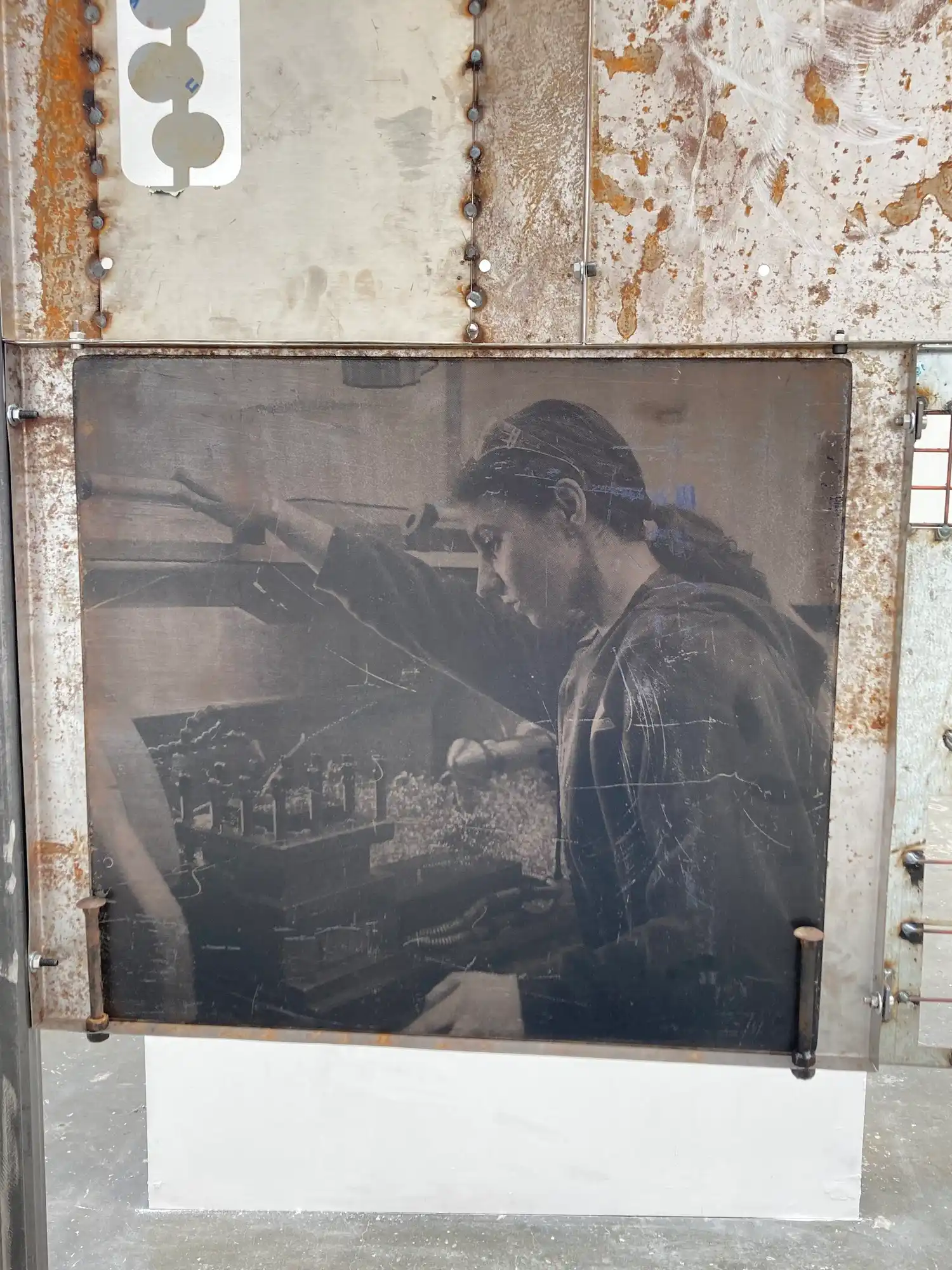 Close up of salvaged steel sheet with screenprint