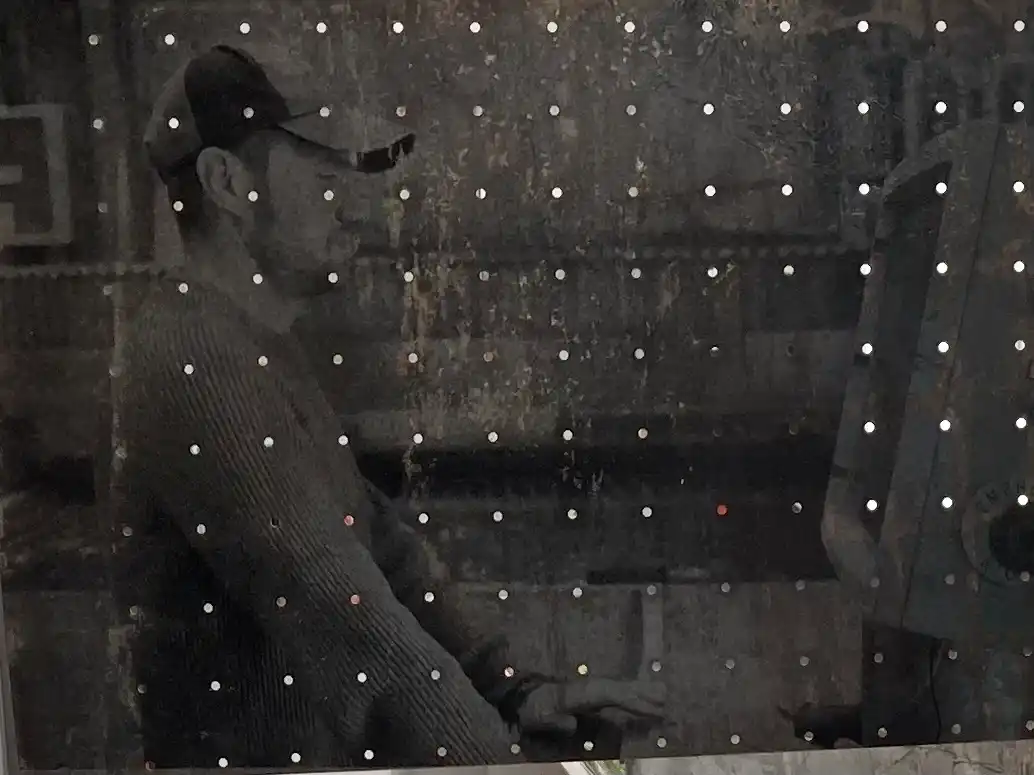 Close up of salvaged perforated steel sheet